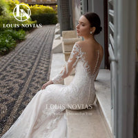 "Enchanting Mermaid Wedding Dress with Detachable Train & Long Sleeves - Elegant Lace Appliqué 2-in-1 Gown for the Perfect Bride"